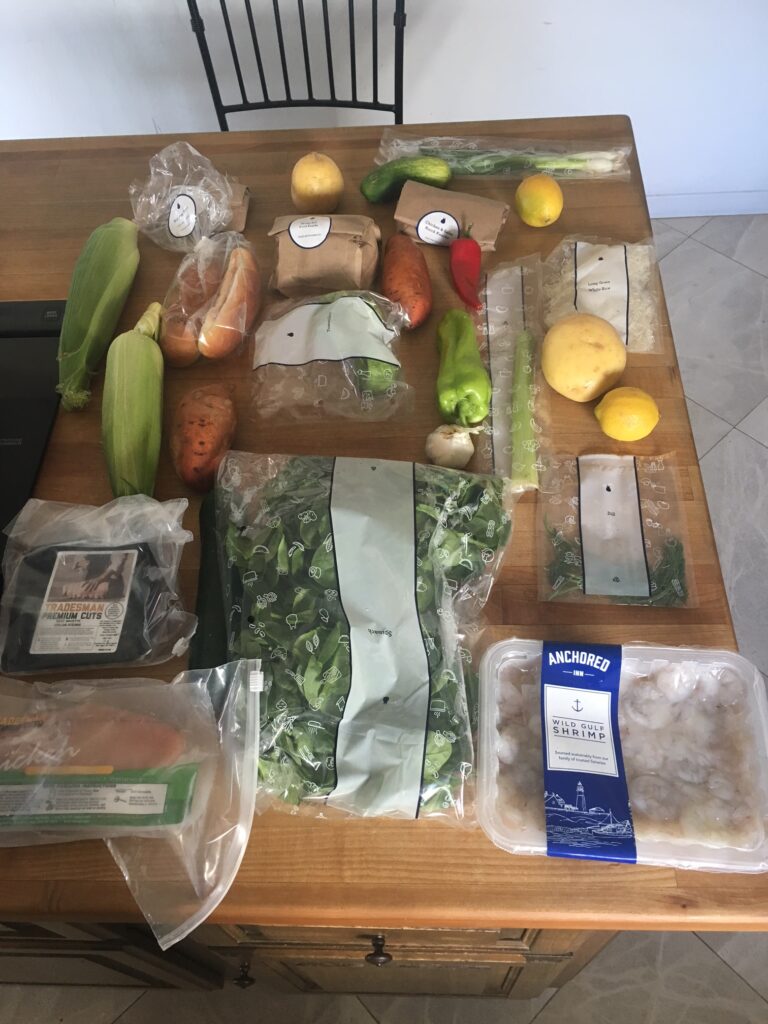 Packaged ingredients supplied in a Blue Apron meal kit.